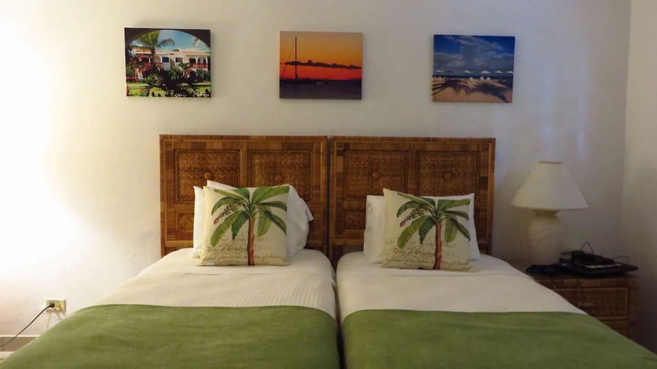 Settle into cozy twin beds after a beach-filled day.