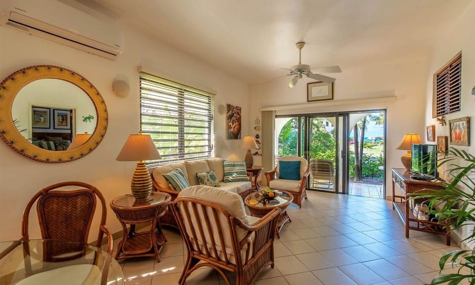 Lounge in airy comfort steps from the sunlit outdoor terrace.