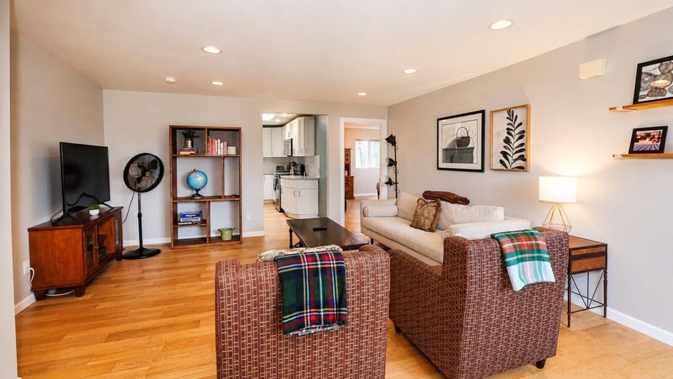 Spacious open-concept living area with cozy seating and easy access to the kitchen.