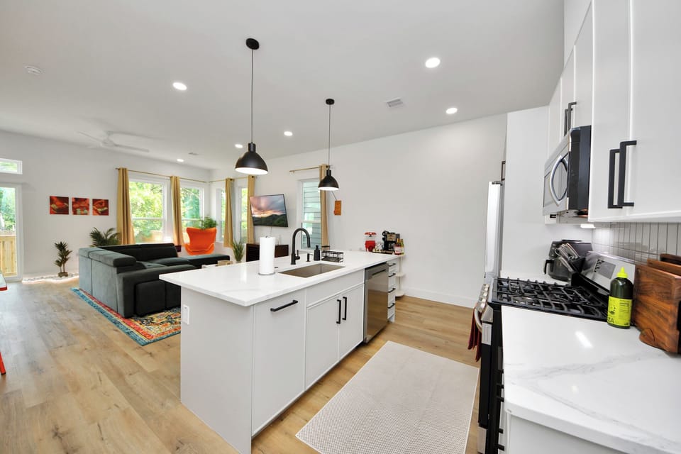 Bright open-concept kitchen and living space with large island