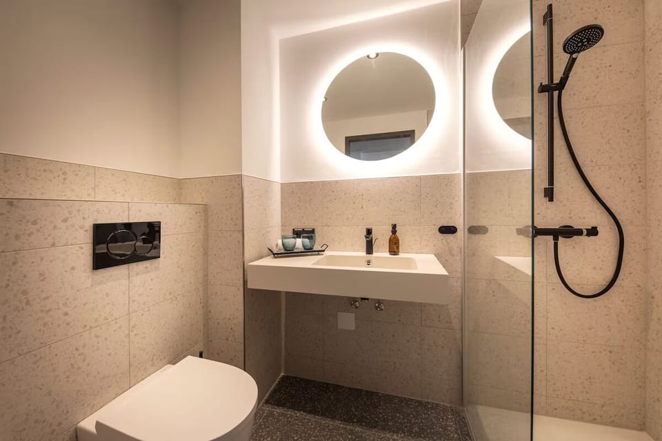Enjoy a spotless, modern bath designed for effortless mornings.