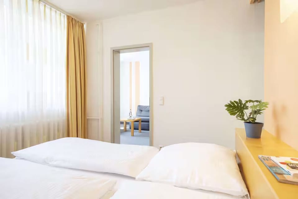 Wake up gently as daylight filters through soft, calming curtains.