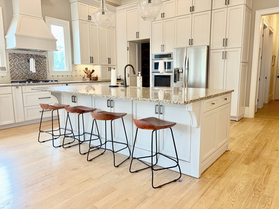 Oversized granite island with seating for 5 guests