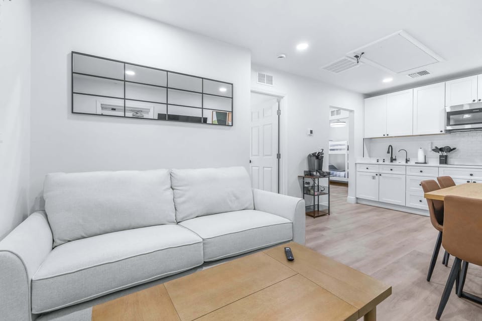 Quaint living area with smart TV and cozy sofa sleeper