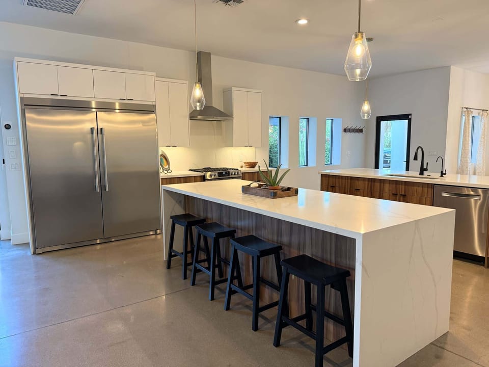 Bright Open-Concept Kitchen with Large Double Island
