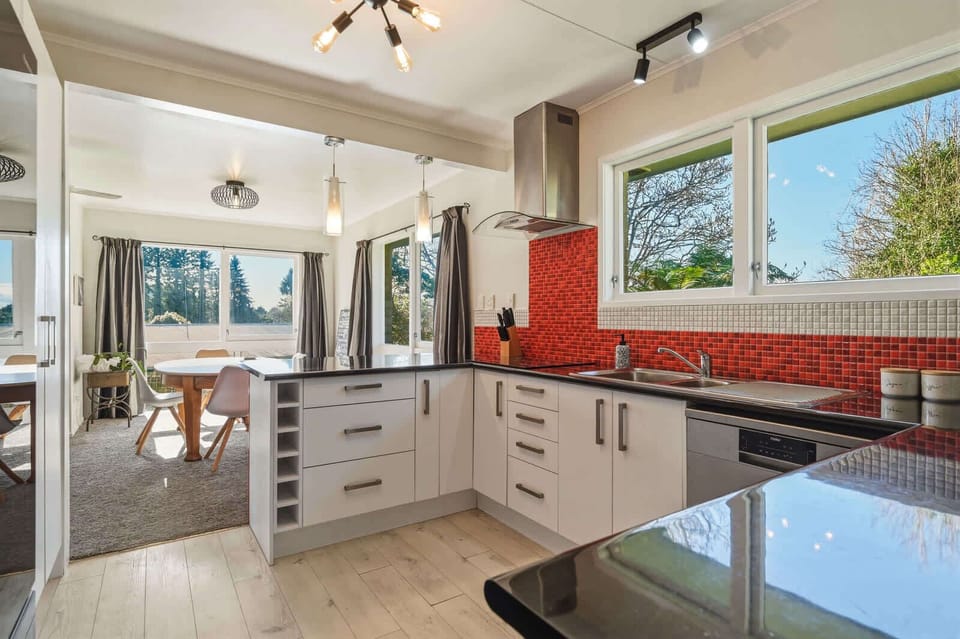 Kitchen with dishwasher and rangehood