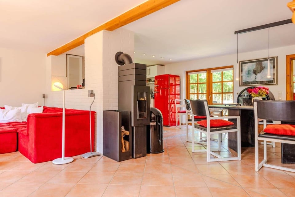 Open living and dining area with wood stove