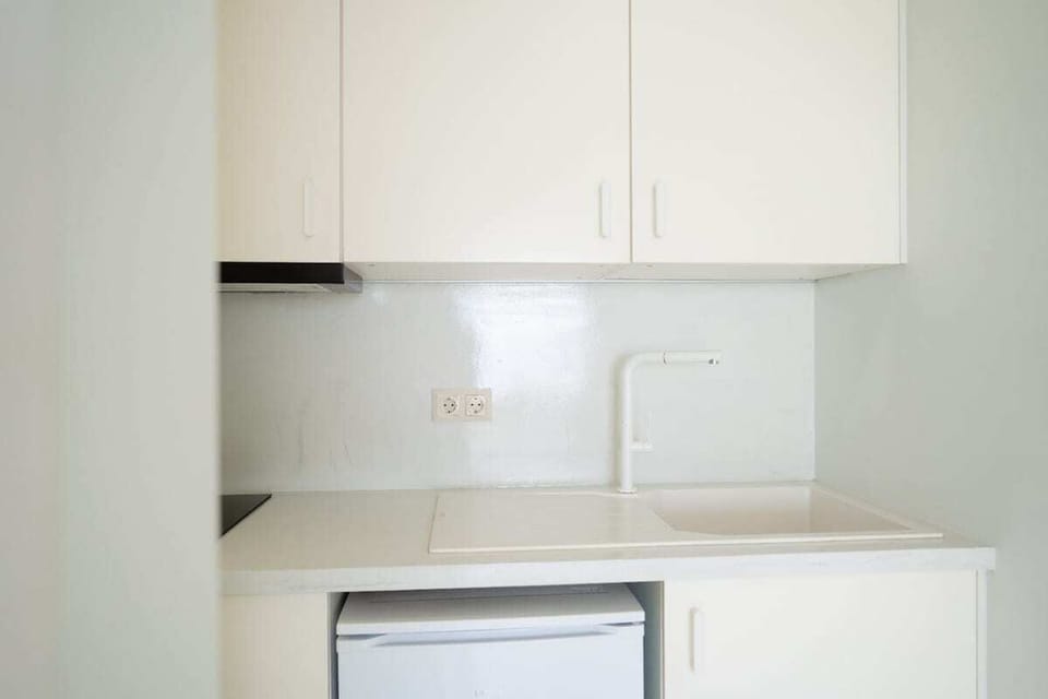 Convenient separate-floor kitchenette with clean, minimalist design.