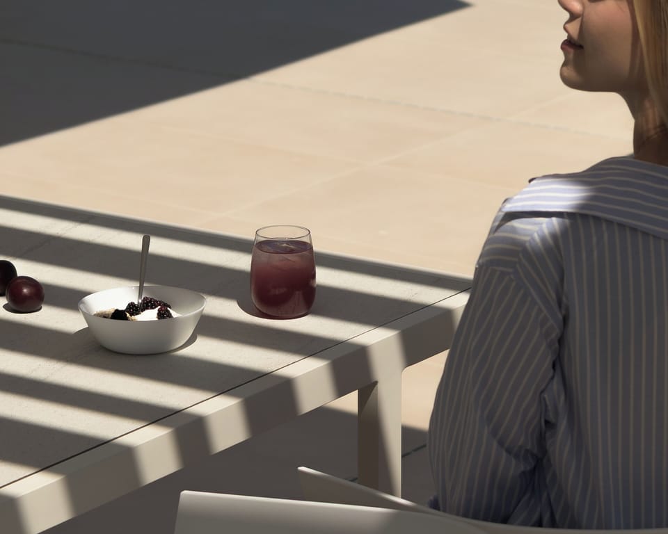 Bespoke outdoor dining settings next to the pool. 
