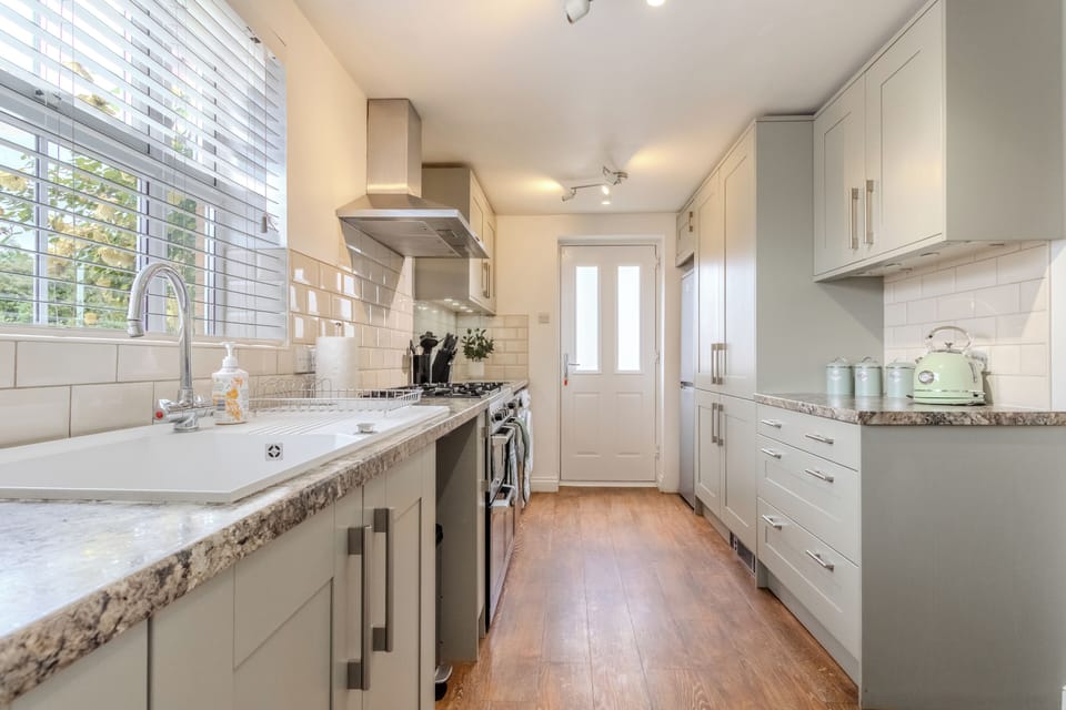 Bright modern kitchen with ample storage and natural light