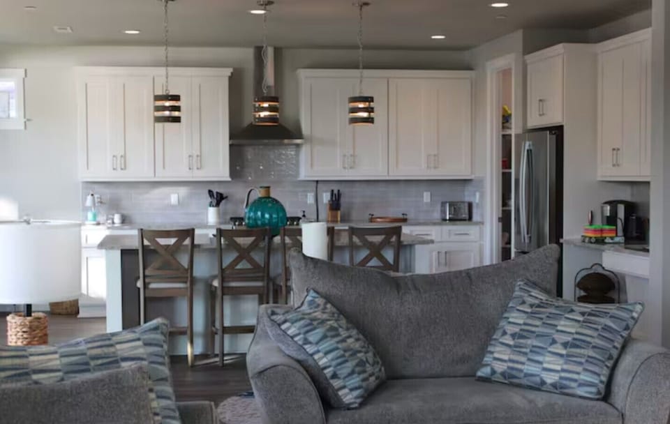 Very inviting open concept downstairs, connecting the kitchen & living areas