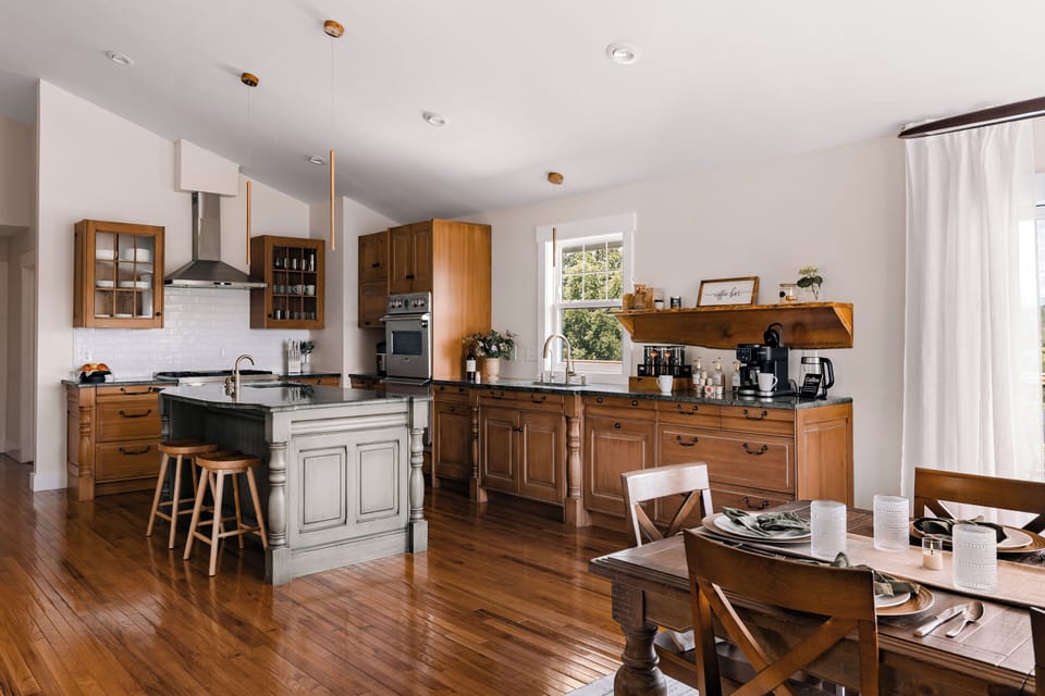 Bright farmhouse-style kitchen with island seating and sunny dining area