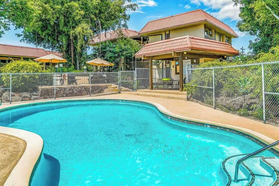 Outdoor Pool Area with Pavilion and Property Exterior View