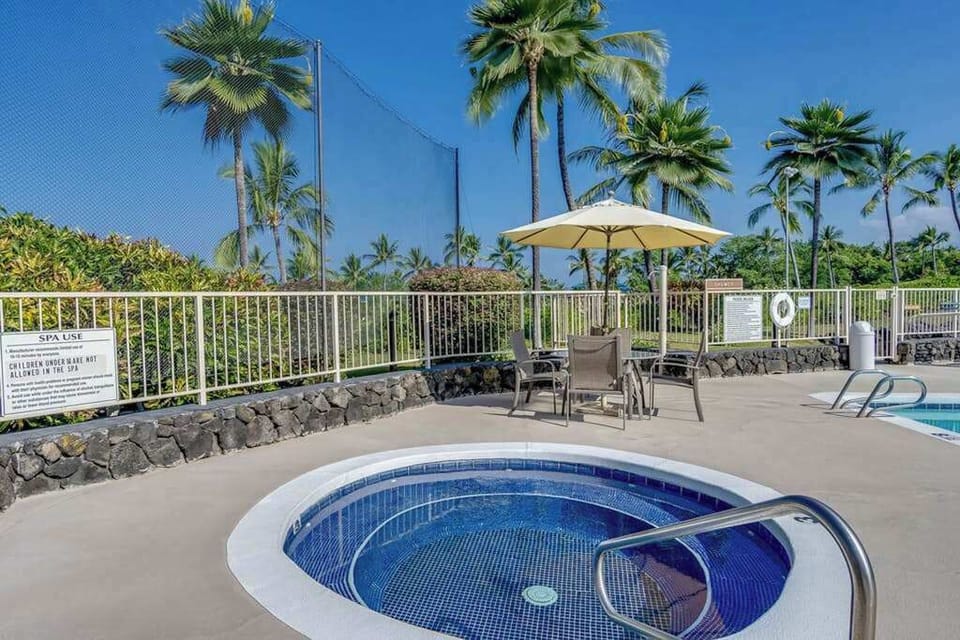 Relaxing Shared Outdoor Hot Tub Surrounded by Tropical Palm Trees