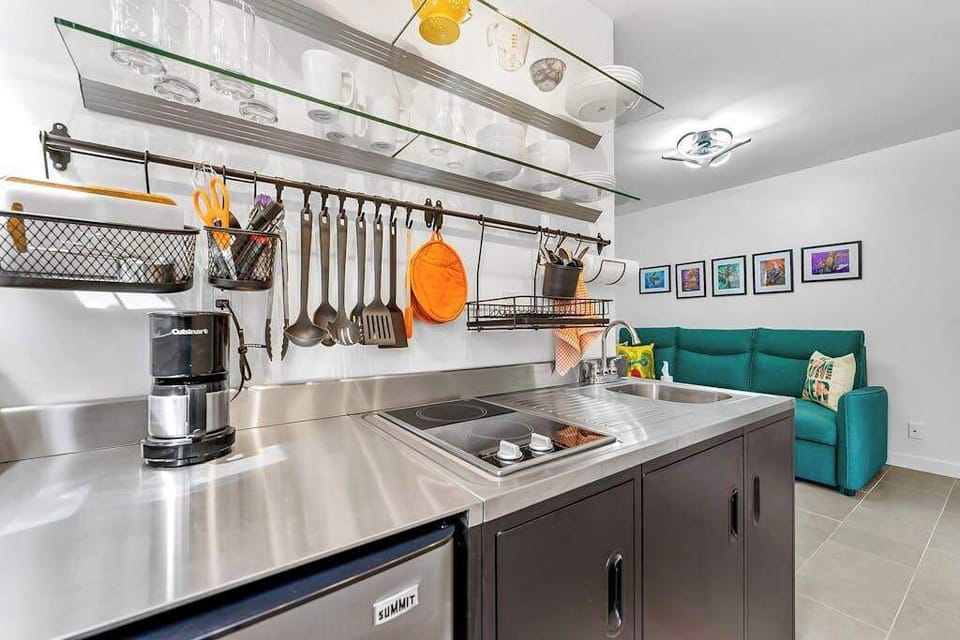 Sleek kitchenette offers convenient space for easy meals