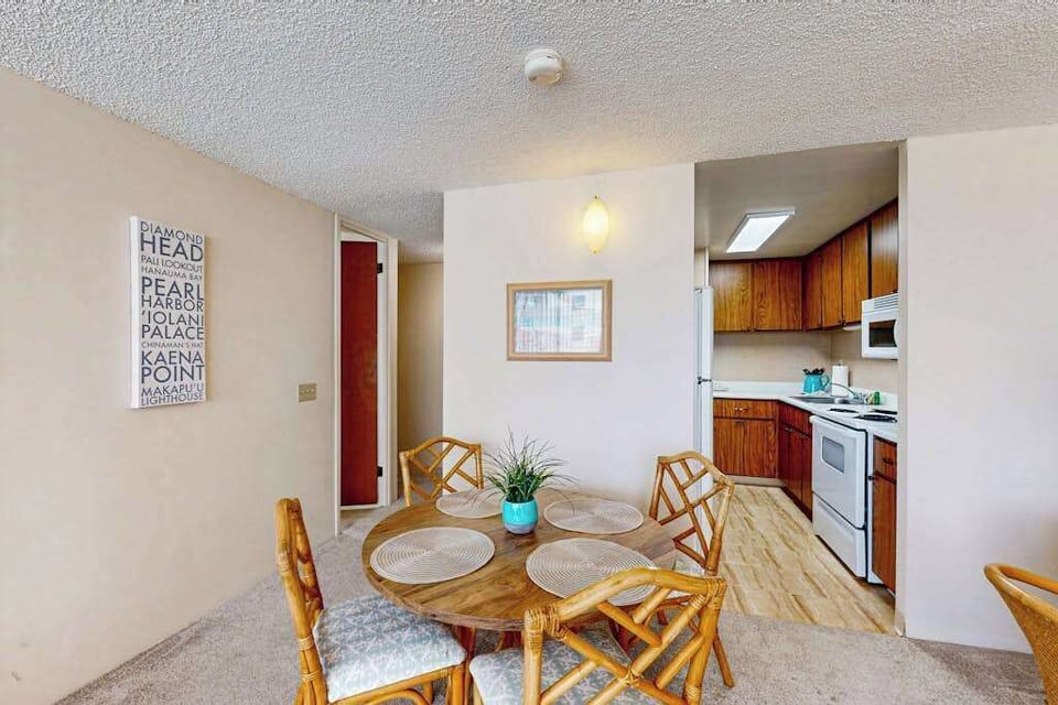 Enjoy meals together in the dining area with convenient access to the fully equipped kitchen.