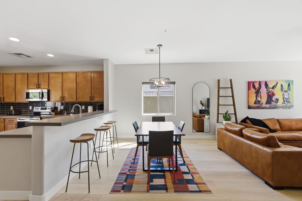 A bright and welcoming dining space with a comfortable table seating four, 