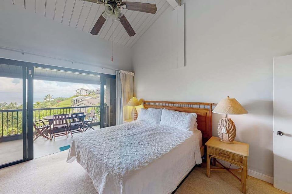 Bedroom retreat features king bed warm accents and gentle daylight