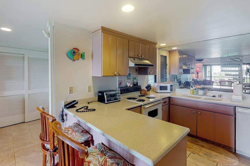 Kitchen counters display practical appliances and bright preparation surfaces today