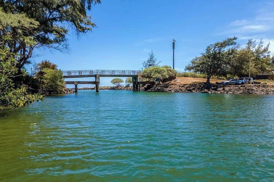 Pono Kai Resort, includes 12-acre grounds, an outdoor pool, a hot tub, a shuffleboard area, a barbecue facility with gas grills, a sauna, golf putting greens, Ping-Pong tables, a croquet lawn, a fitness center, tennis courts, and laundry facilities.