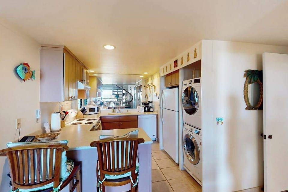 Enjoy casual meals beside the bright and well-equipped kitchen area