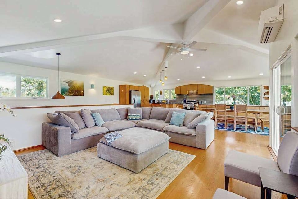 This open-concept great room features a bright, airy coastal style designed for group gatherings