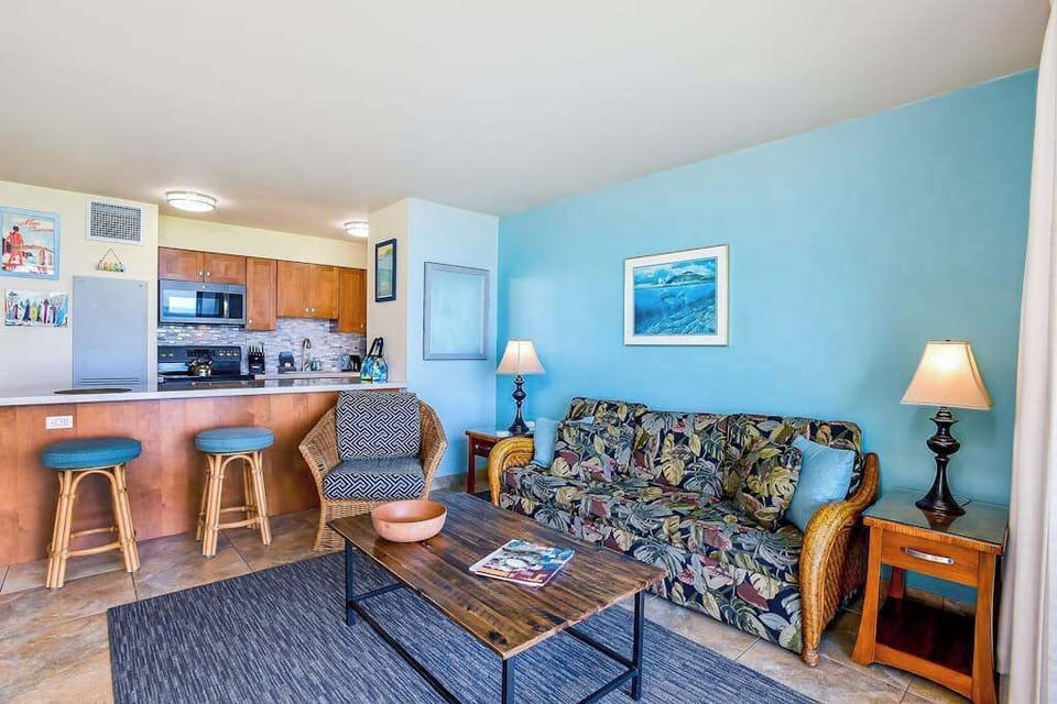 Bright tropical condo living room with sofa bed