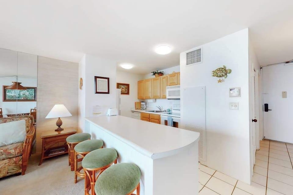 Barstools with extra seating at the kitchen counter.  