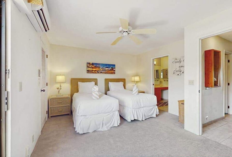 Welcomes island breezes with twin bedding and windows
