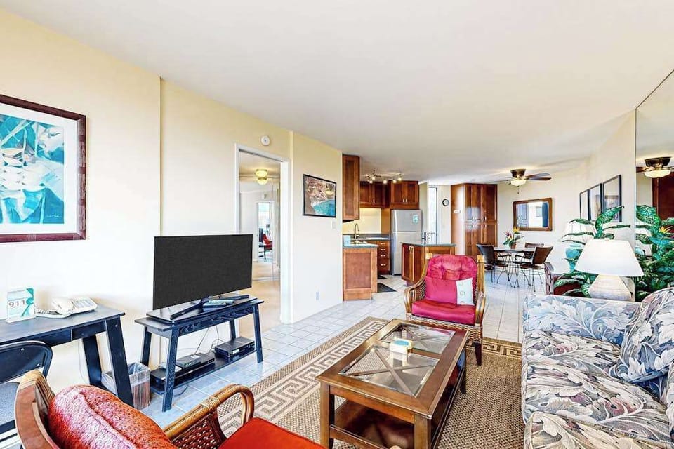 Living Area with Flat-Screen TV, Work Desk & Kitchen View