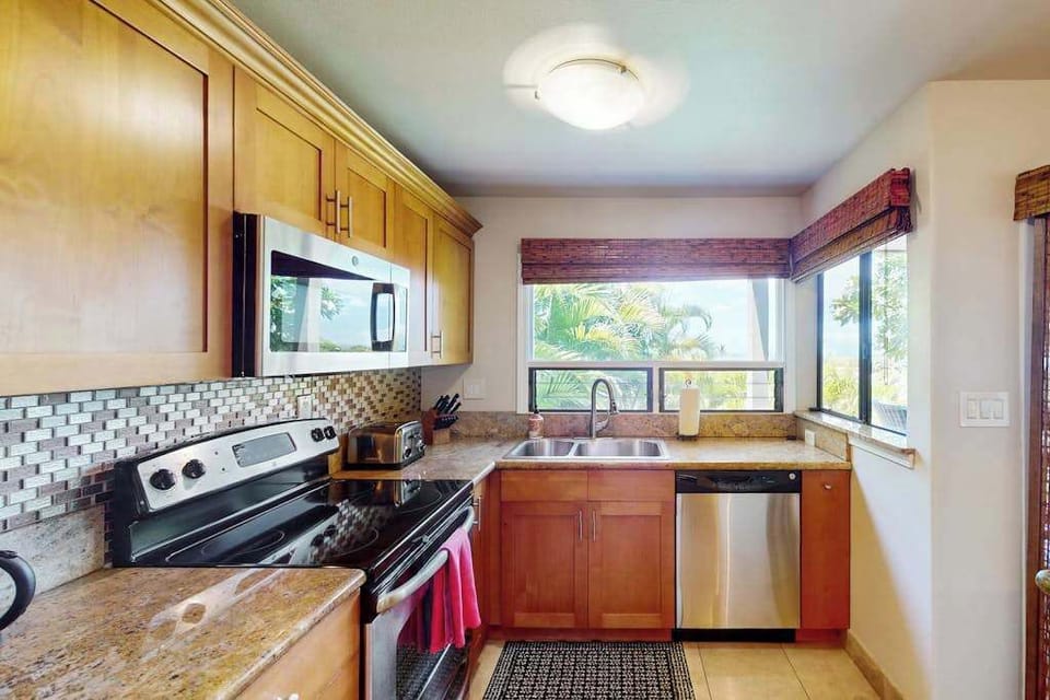 Spacious kitchen with dining access for shared meal