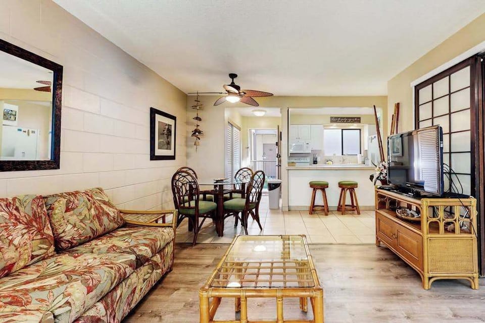 Open airy living room with flat screen tv and a pull out sofa for extra guests.