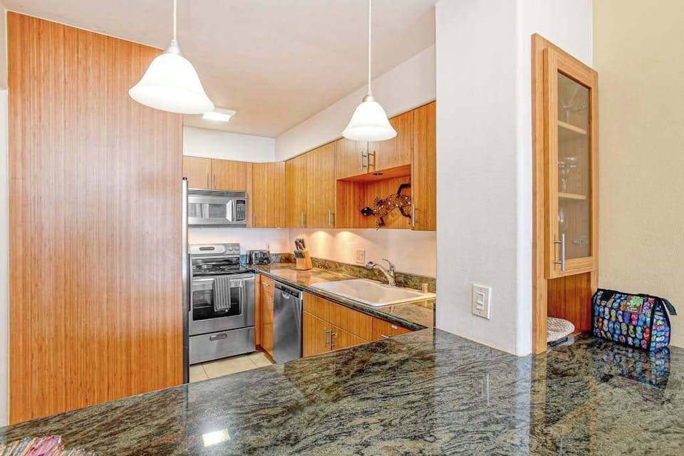 Prepare fresh ingredients in the sleek kitchen, complete with granite countertops and a full suite of stainless steel appliances. 
