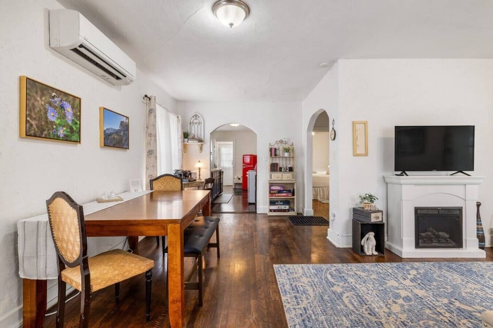 Just beside the living area is the dining table, creating a convenient space to enjoy meals, play games, or plan your next day`s adventures.