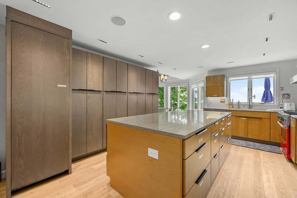 Large kitchen island offering ample space for cooking, gathering, and entertaining, serving as the heart of the home