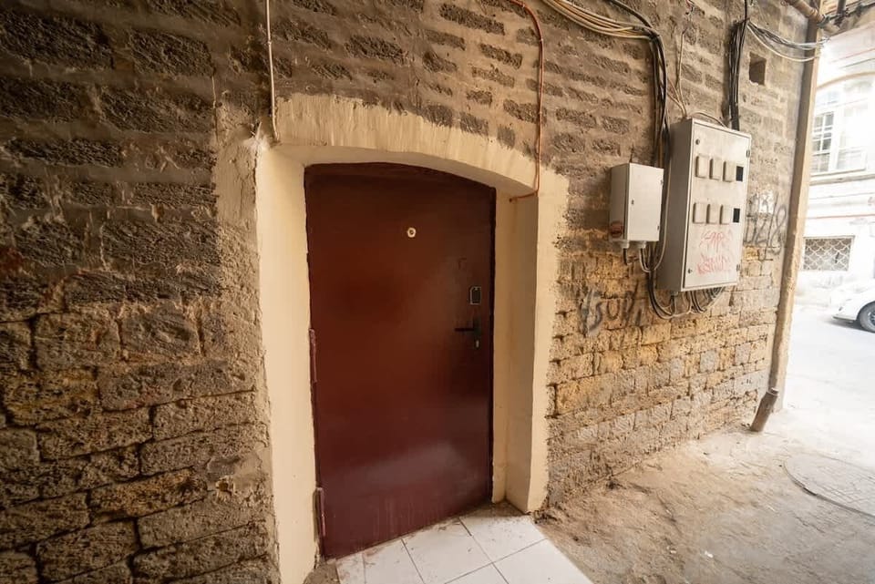 Private apartment entrance in the historic stone building.