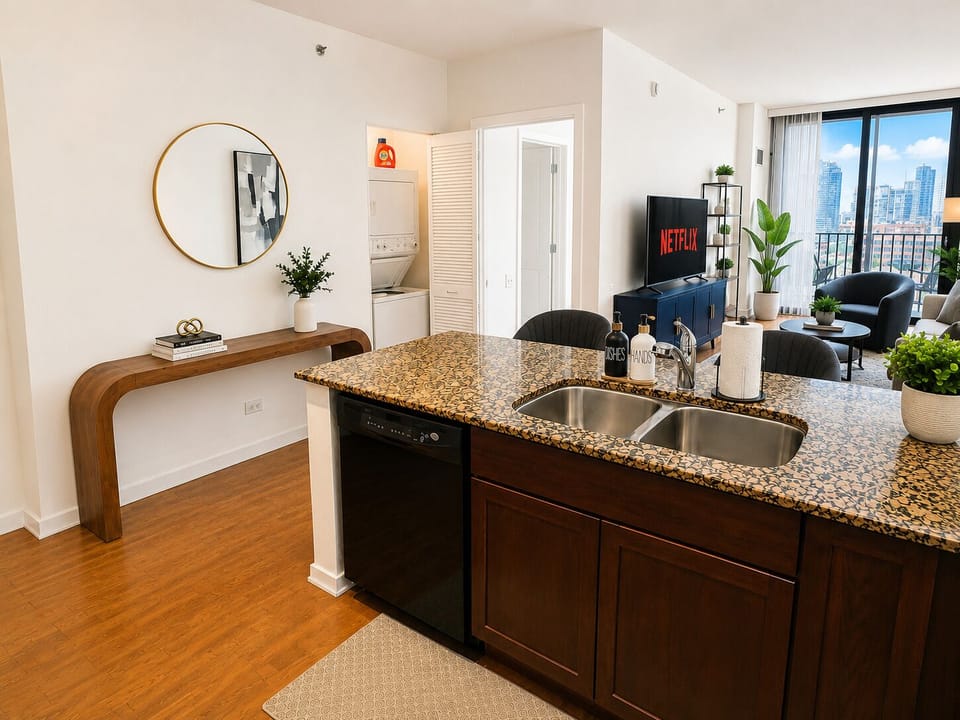 Bright city-view condo with granite island, in-unit laundry & stylish lounge