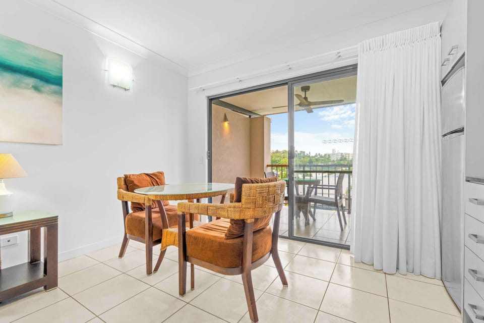 Savour breakfast in the dining area before heading to the beach, with the balcony inviting you outside to enjoy peaceful lagoon views throughout the day.