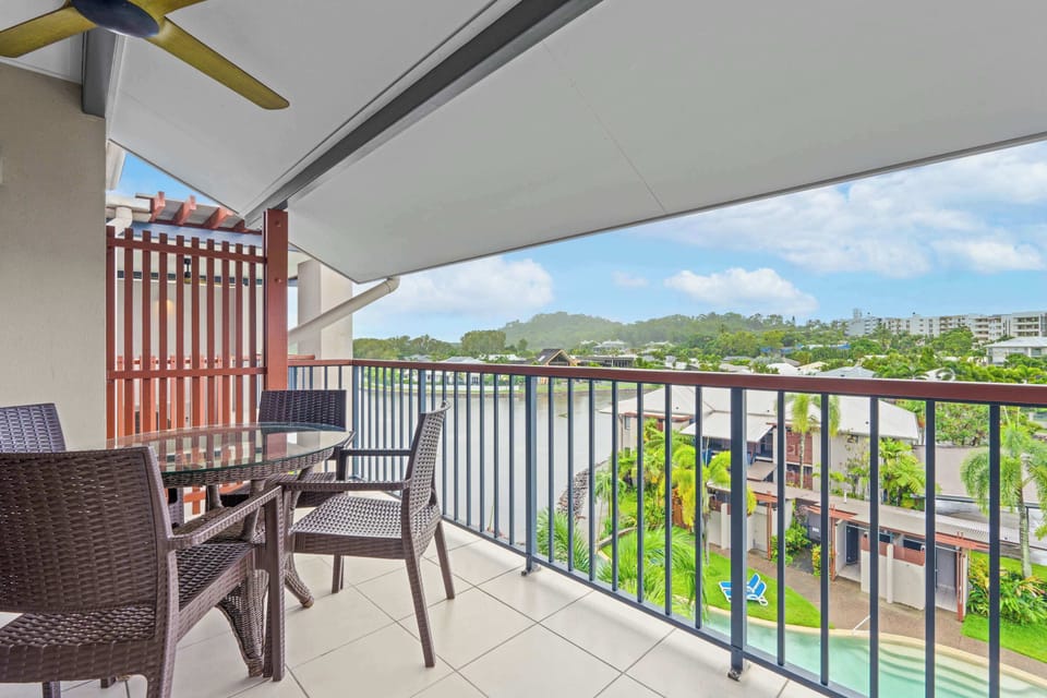 Dine alfresco on the main balcony while overlooking the lagoon, with outdoor seating providing a peaceful setting above the tropical surrounds.