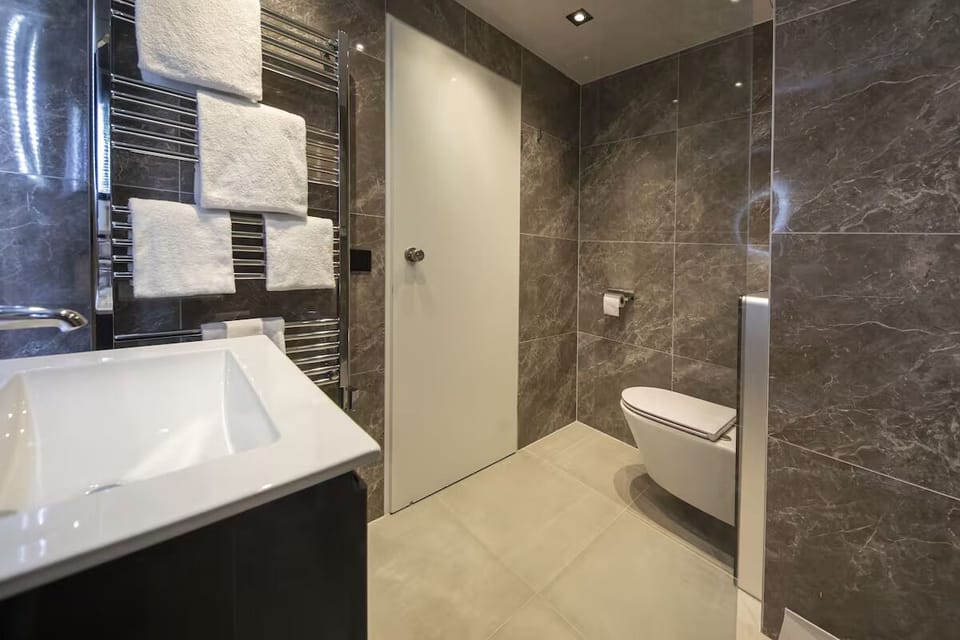 Start your morning with plush towels and warm lighting.