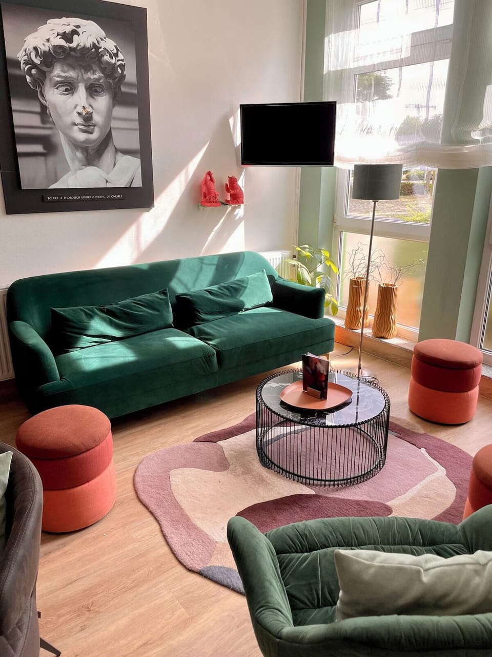 Unwind in plush seating with sunlight and calm vibes.