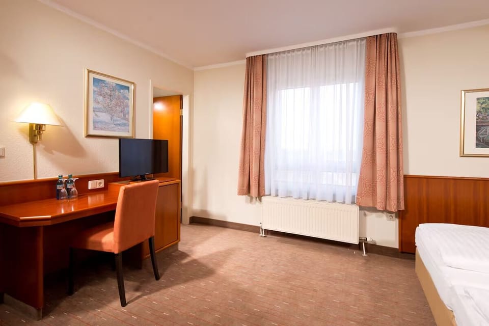 Catch up on emails at the desk, then unwind by the window.