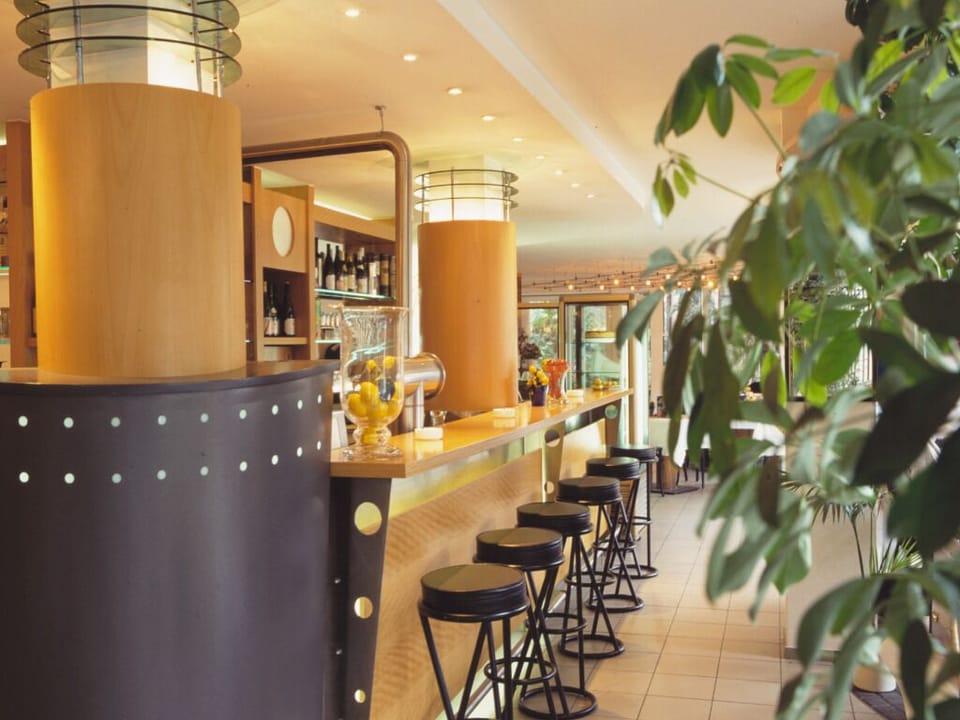 Lean in for lively conversations at our stylish bar counter.
