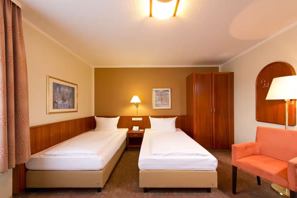 Stretch out comfortably with twin beds and soft ambient lighting.