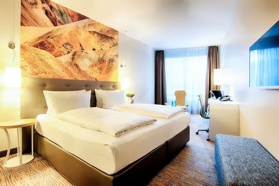 Relax in a warm, contemporary room with premium bedding.