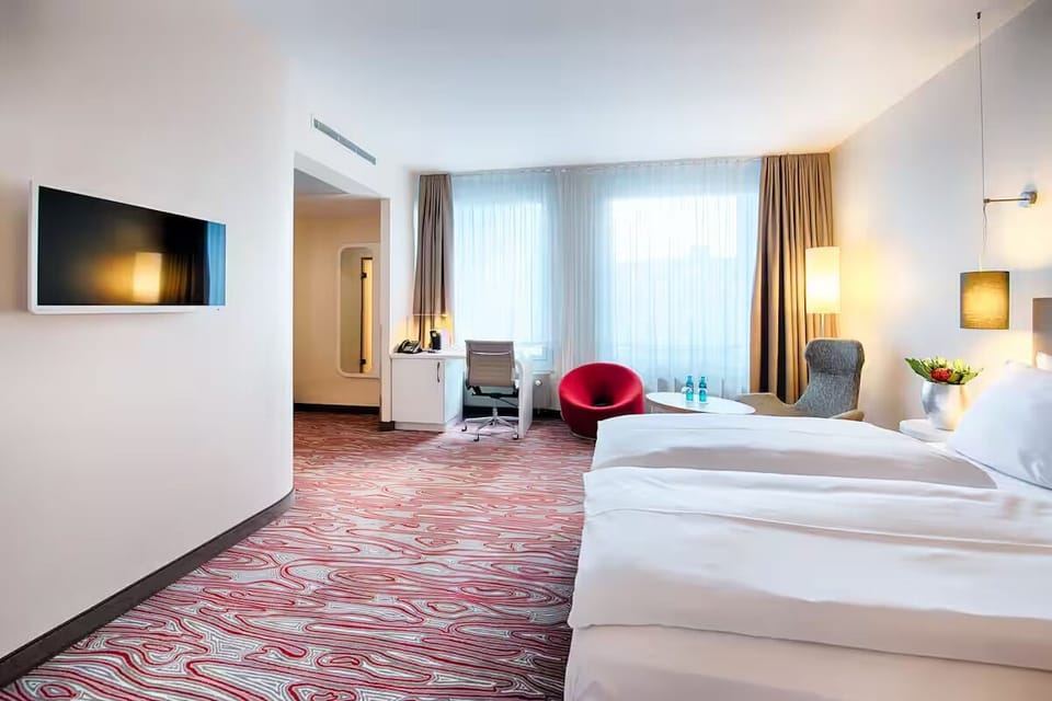Stretch out in a spacious room with cozy seating corner.