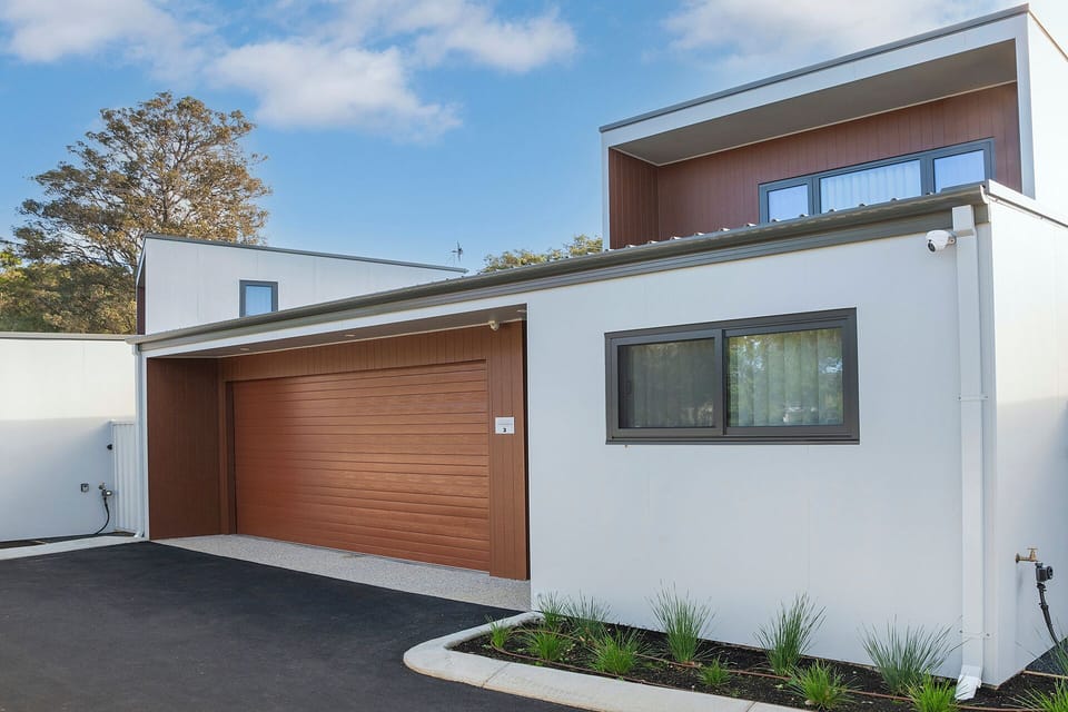 Modern home exterior with private garage and sleek curb appeal