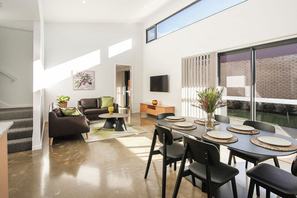 Bright open-plan living with high ceilings and private courtyard access