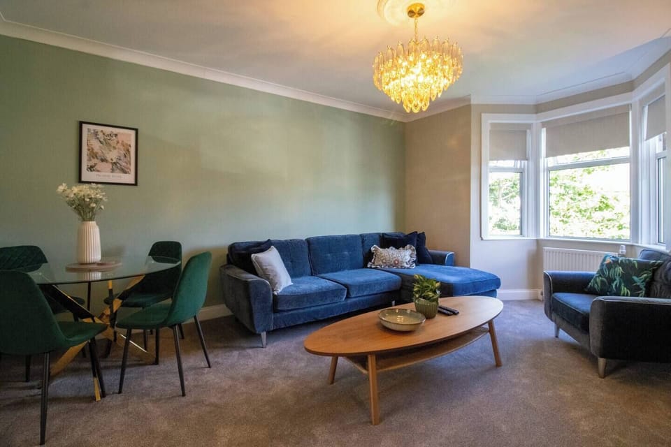 Relax in our bright, inviting living room featuring comfortable seating, stylish décor, and plenty of natural light. It's the perfect place to unwind after a day of exploring, enjoy a movie night, or spend quality time with family and friends.