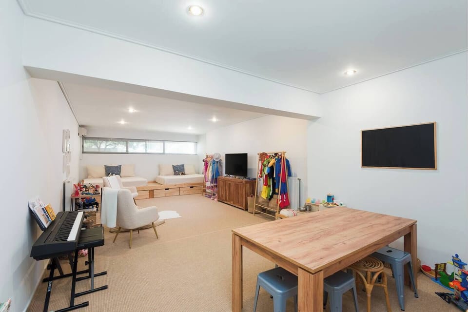 The playroom has two queen sized beds
